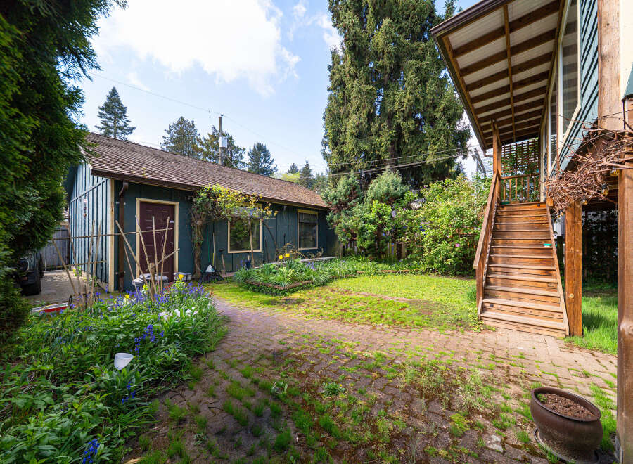 Discover the charm of this property, featuring a beautifully landscaped yard and a welcoming outdoor space.