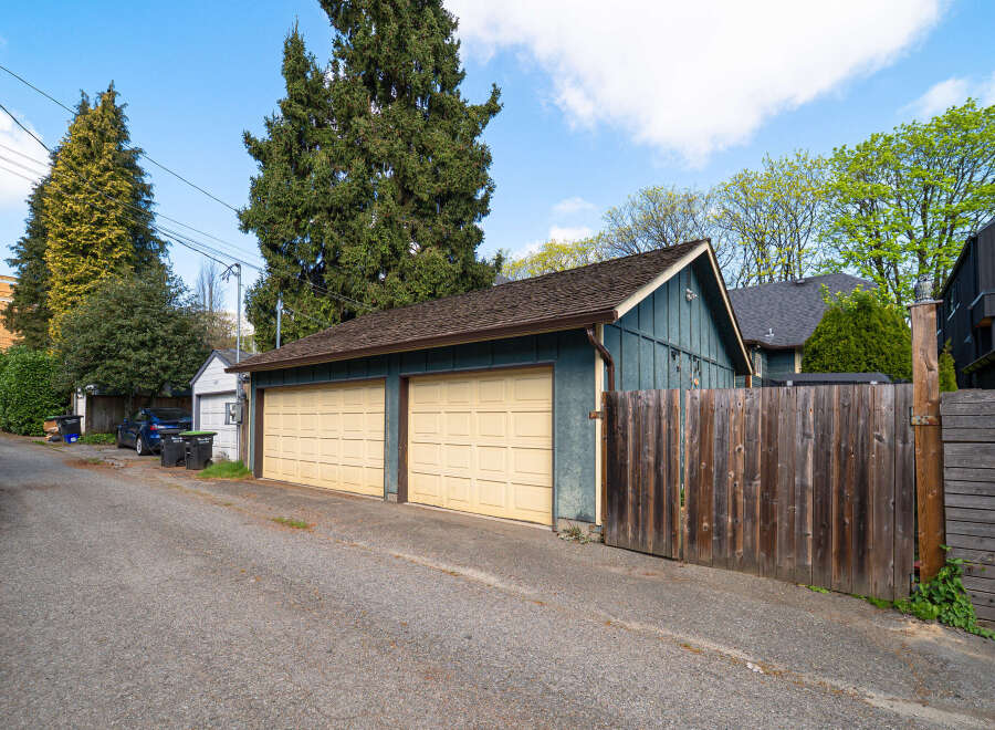 Discover this charming property featuring a detached garage with two bays, perfect for parking or storage.