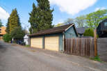 Discover this charming property featuring a detached garage with two bays, perfect for parking or storage.