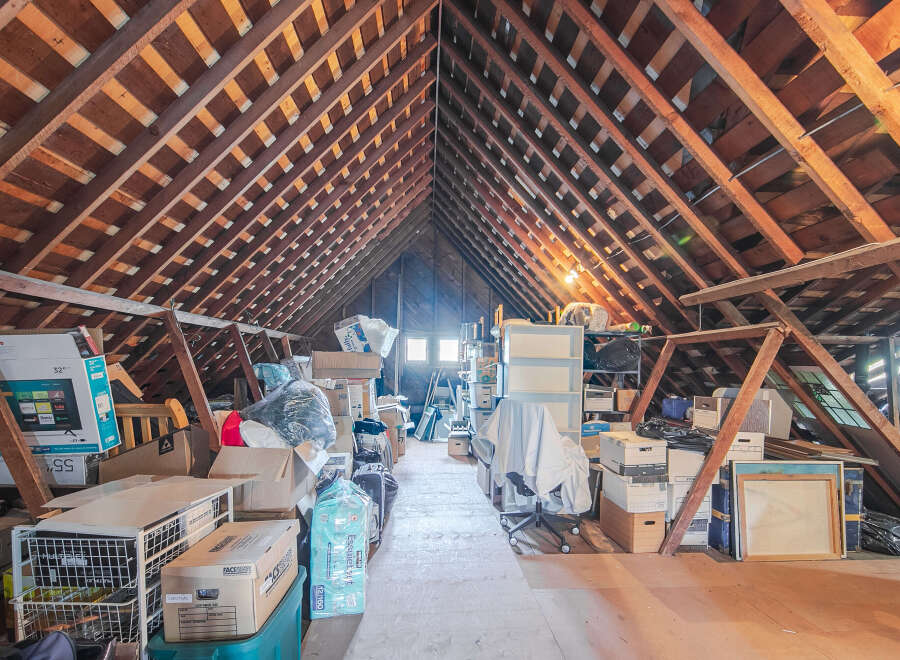 Explore the potential of this spacious attic, perfect for storage or conversion.