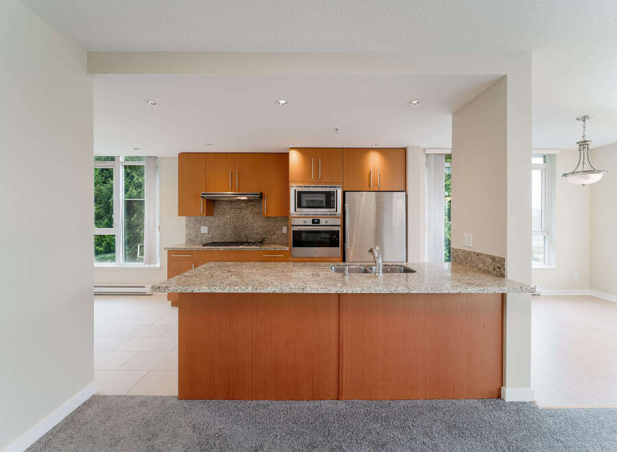 This stunning kitchen boasts modern appliances and ample counter space, perfect for culinary enthusiasts.