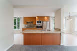 This stunning kitchen boasts modern appliances and ample counter space, perfect for culinary enthusiasts.