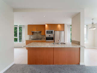 This stunning kitchen boasts modern appliances and ample counter space, perfect for culinary enthusiasts.