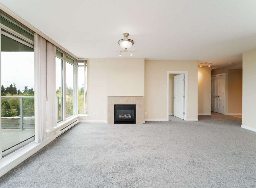 Step into luxury with this stunning property featuring a cozy fireplace, perfect for those chilly evenings.
