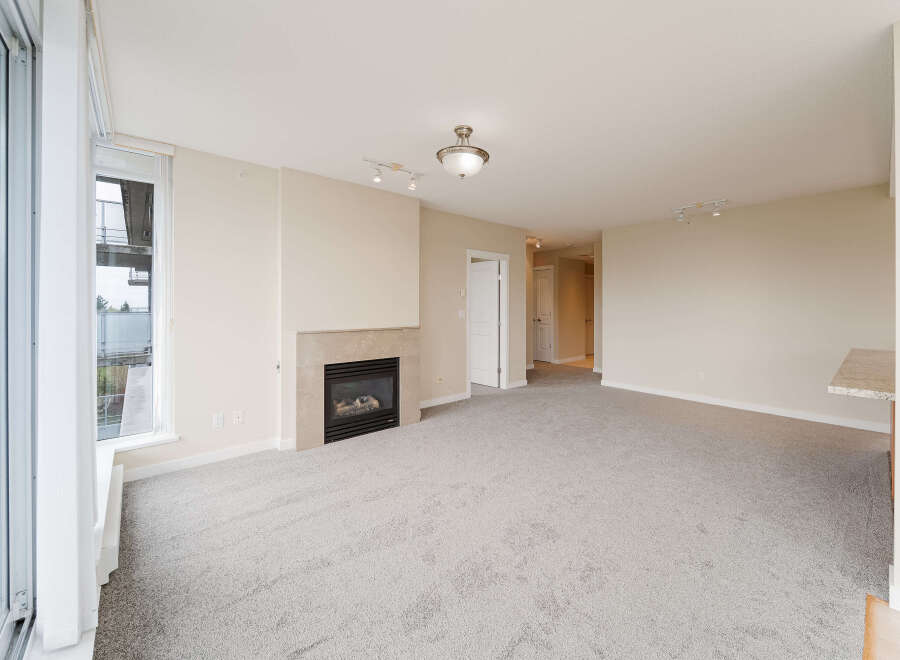 Step into luxury with this stunning living space, featuring a cozy fireplace perfect for those chilly evenings.