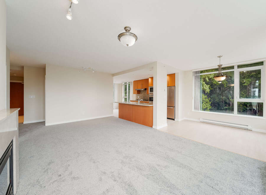 Step into modern elegance with this stunning property, featuring a spacious open-concept living area.
