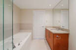 Step into a luxurious bathroom with a modern design.