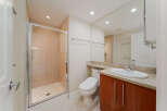 Step into a modern bathroom featuring a sleek glass-enclosed shower and elegant tile work.