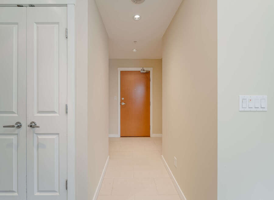 Step into this inviting entryway, showcasing a bright and airy atmosphere.