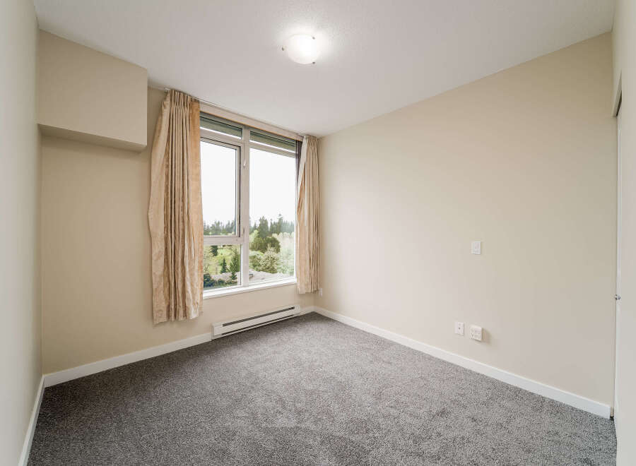 Step into this bright and airy room, featuring a large window that floods the space with natural light.
