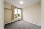 Step into this bright and airy room, featuring a large window that floods the space with natural light.