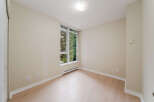 This bright and airy room features a large window that lets in plenty of natural light.