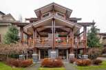 This stunning property boasts a unique architectural design with exposed wooden beams and multiple levels of balconies.