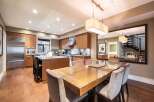 Step into luxury with this stunning kitchen and dining area.