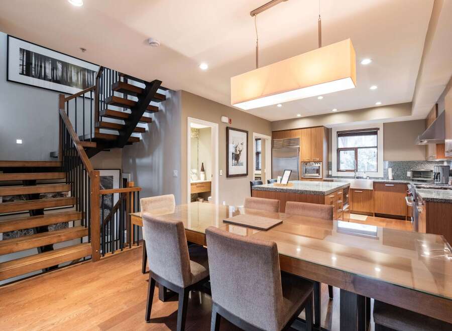 This stunning property boasts a modern kitchen with stainless steel appliances and granite countertops, perfect for culinary enthusiasts.