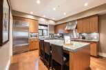 This stunning kitchen boasts a modern design with sleek stainless steel appliances and custom cabinetry.