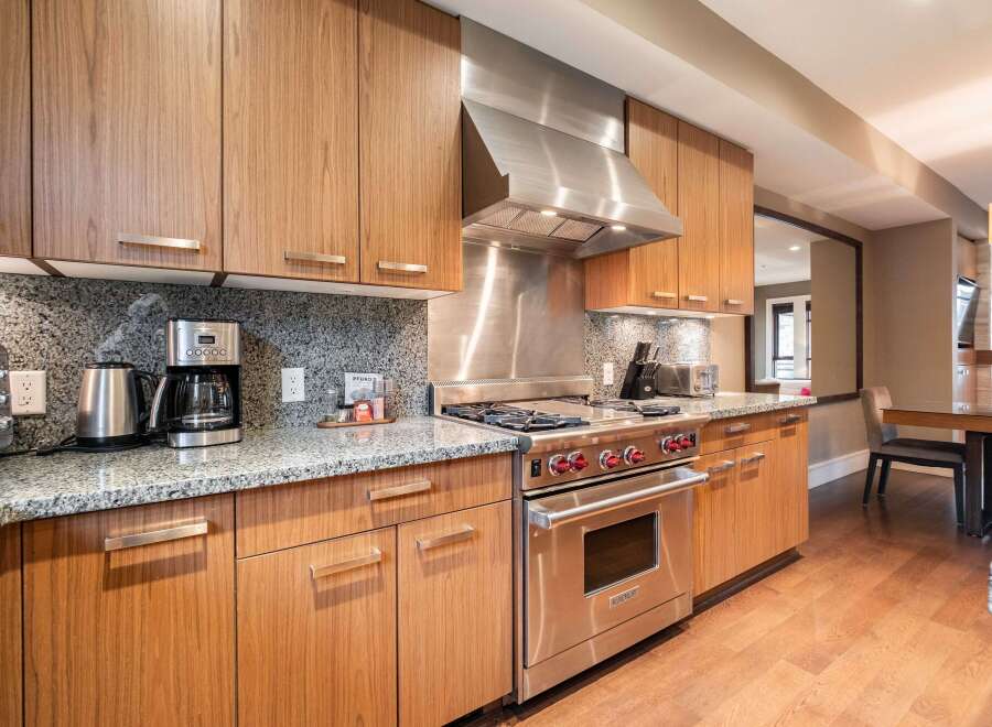 This stunning kitchen boasts modern design and high-end appliances, perfect for culinary enthusiasts.