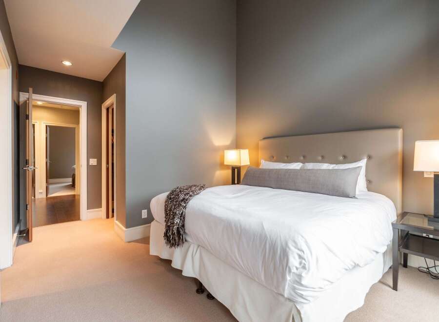 Step into luxury with this stunning bedroom featuring a plush bed, perfect for a restful night's sleep.