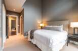 Step into luxury with this stunning bedroom featuring a plush bed, perfect for a restful night's sleep.