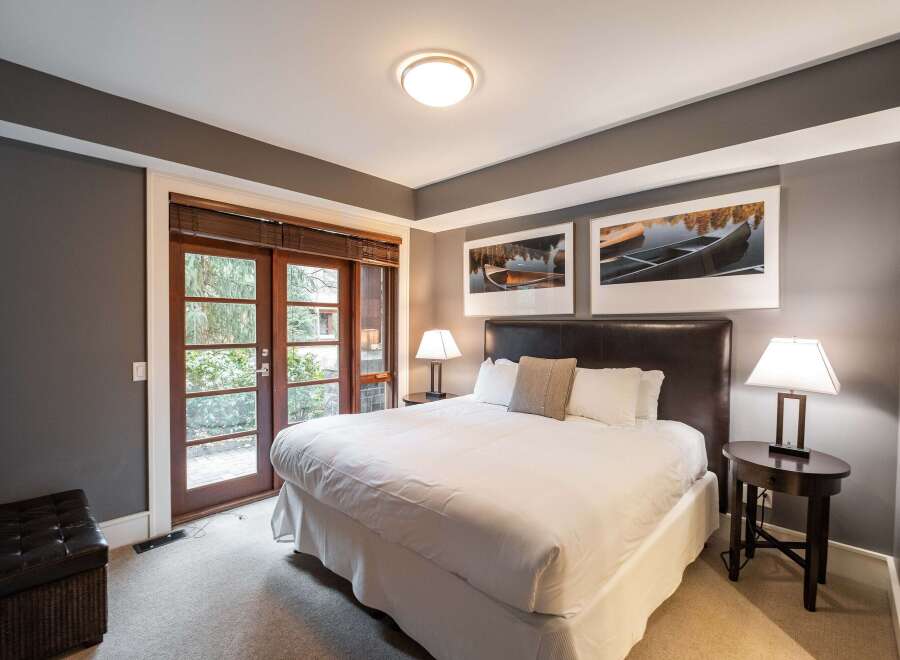 Step into luxury with this stunning bedroom featuring a cozy bed, perfect for a restful night's sleep.