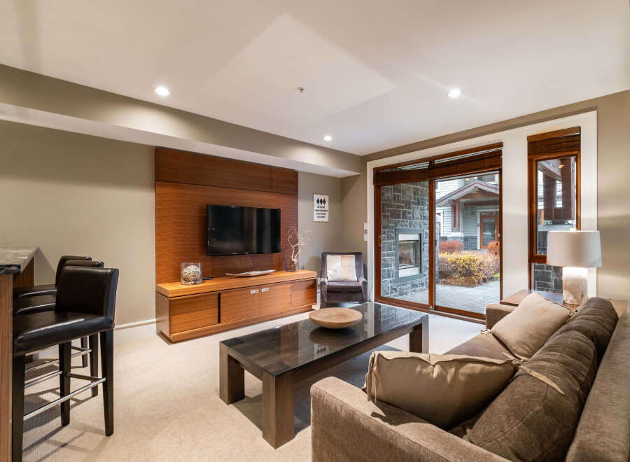 This stunning living room boasts a modern design with a cozy atmosphere, perfect for relaxation and entertainment.