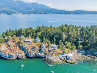 Discover a stunning waterfront property nestled on a private island, offering unparalleled views and tranquility.