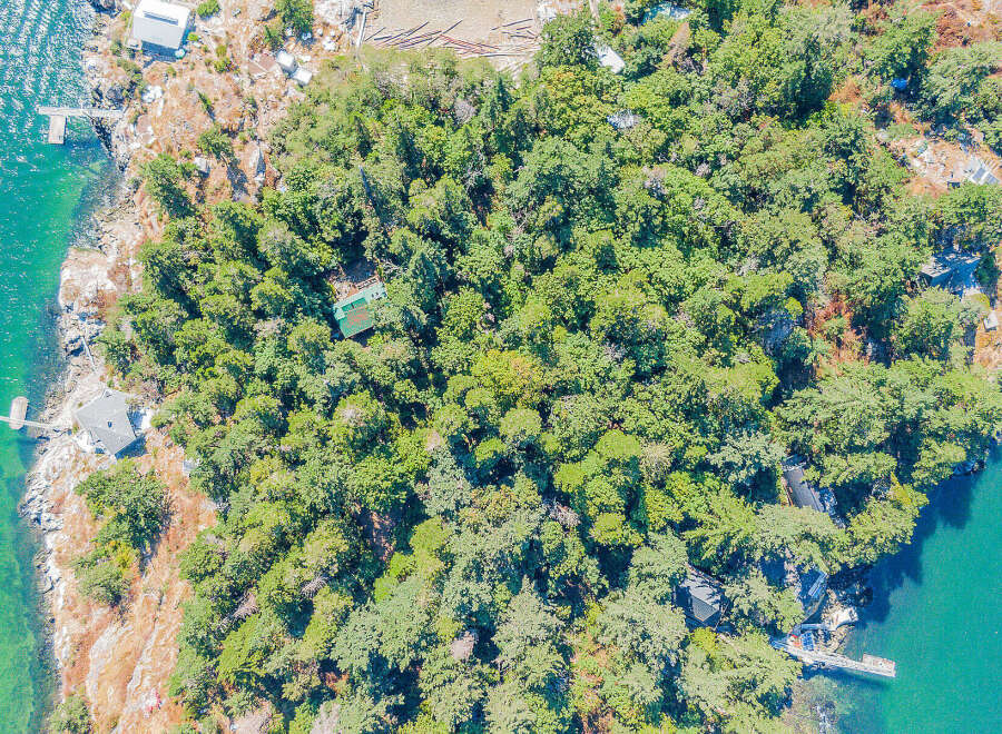 Discover a secluded island retreat with this stunning aerial view.
