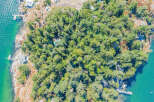 Discover a secluded island retreat with this stunning aerial view.