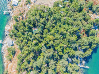 Discover a secluded island retreat with this stunning aerial view.