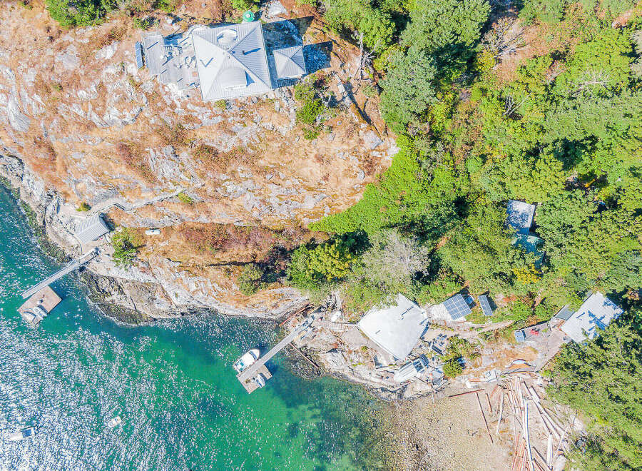 Discover a stunning waterfront property nestled on a rocky shoreline, offering breathtaking ocean views and unparalleled privacy.
