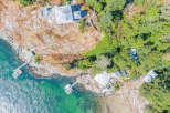 Discover a stunning waterfront property nestled on a rocky shoreline, offering breathtaking ocean views and unparalleled privacy.