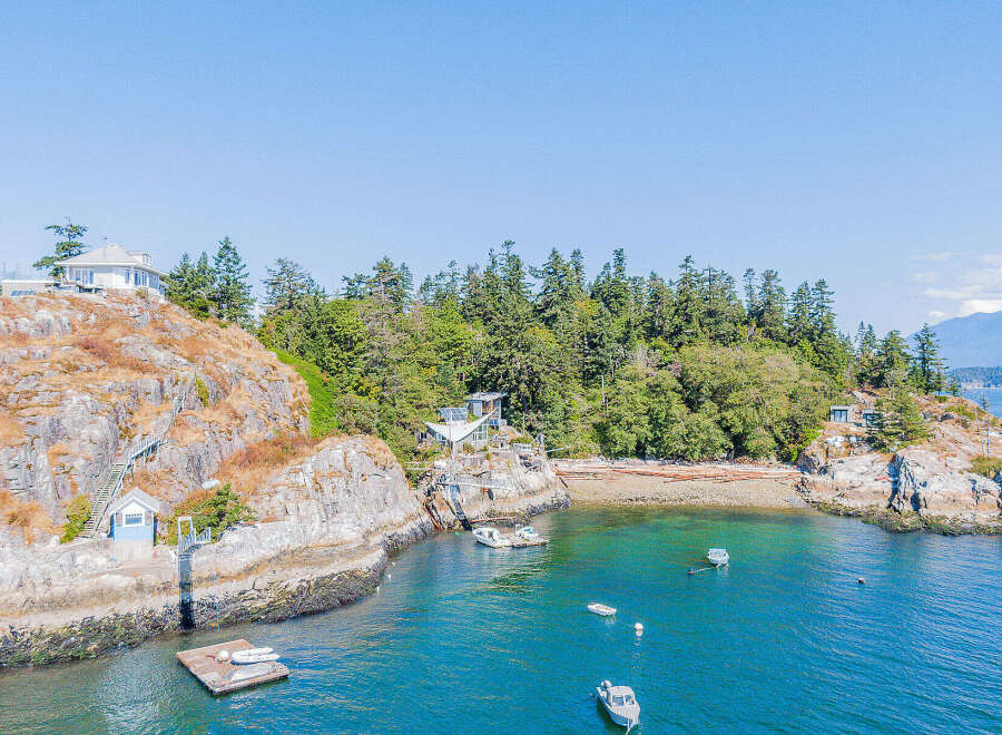 Discover a stunning waterfront property nestled on a rocky island, offering unparalleled privacy and breathtaking ocean views.