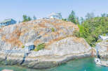 Discover a stunning waterfront property nestled on a rocky island, offering unparalleled privacy and breathtaking ocean views.