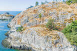 Discover a stunning coastal retreat nestled on a rocky hillside with breathtaking ocean views.