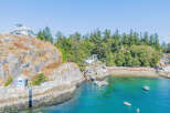 Discover a stunning waterfront property nestled on a rocky coastline, offering unparalleled views and privacy.