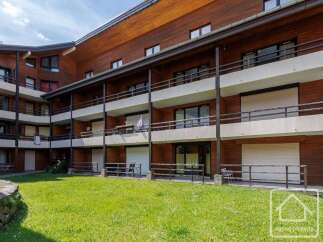 Discover this charming property featuring a beautiful wooden facade and multiple balconies, perfect for enjoying the scenic views.