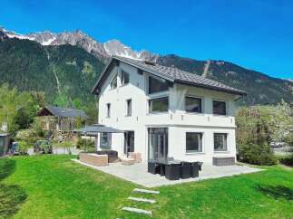 Discover your dream home nestled in the heart of the mountains! This stunning property boasts a modern design with spacious windows, offering breathtaking views of the surrounding landscape.