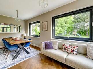 This stunning property boasts a modern interior with a spacious living area, perfect for entertaining.