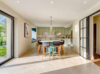Step into luxury with this stunning kitchen! Featuring a spacious island, modern cabinetry, and ample natural light, this space is perfect for both cooking and entertaining.