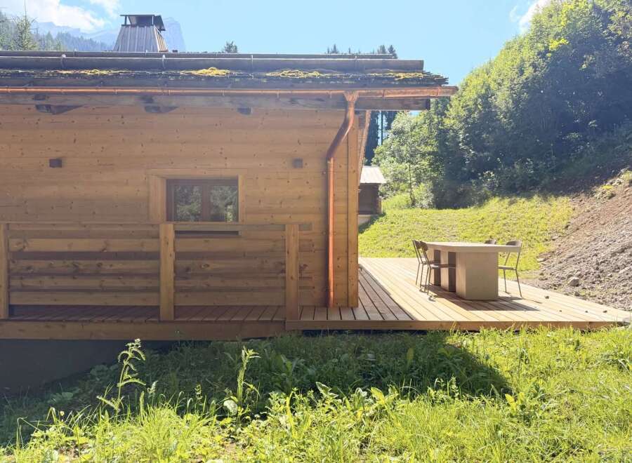 Discover the charm of this stunning wooden cabin nestled in a serene natural setting.