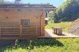 Discover the charm of this stunning wooden cabin nestled in a serene natural setting.