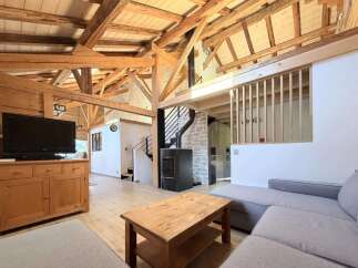 This stunning property boasts a unique blend of rustic charm and modern design.