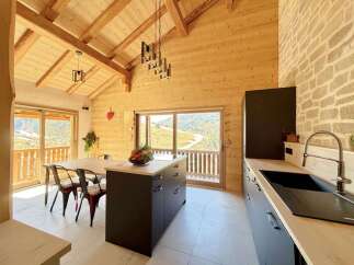 This stunning kitchen boasts a warm and inviting atmosphere with its wooden accents and modern design.