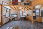 Discover the charm of this cozy mountain retreat, featuring a unique loft design and stunning views.
