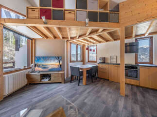 Discover the charm of this cozy mountain retreat, featuring a unique loft design and stunning views.