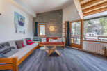 This cozy living space features a comfortable seating area, perfect for relaxing after a day on the slopes.