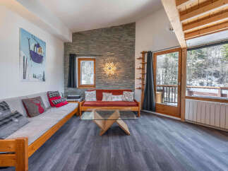 This cozy living space features a comfortable seating area, perfect for relaxing after a day on the slopes.