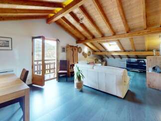 Discover the charm of this stunning property featuring a unique wooden beamed ceiling and a bright, airy living space.