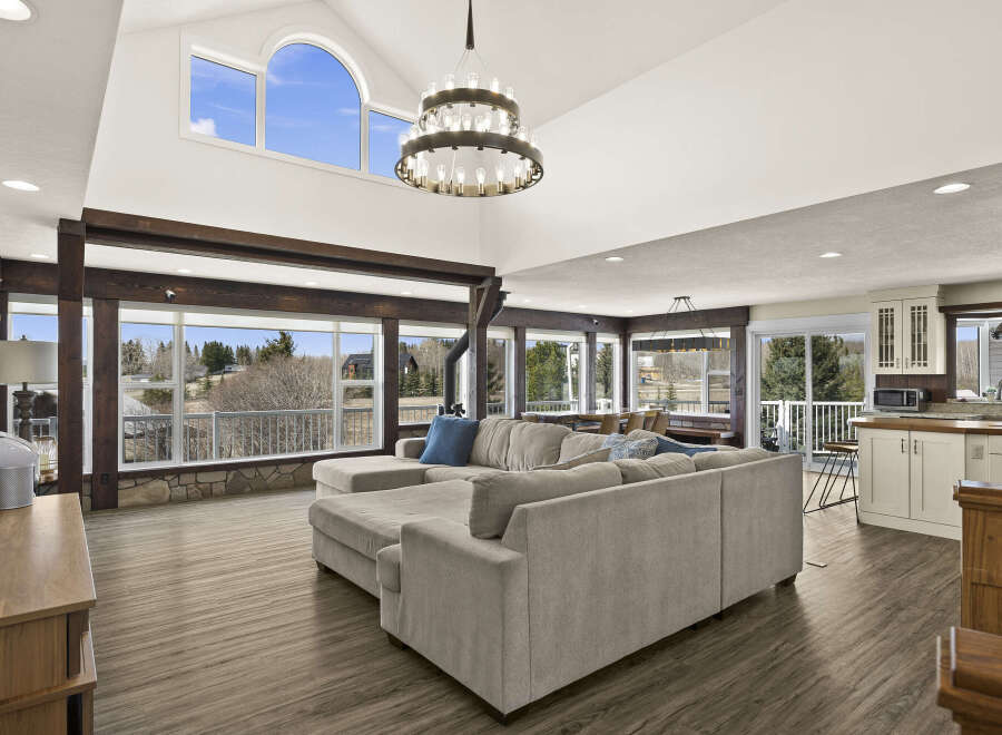 This stunning property boasts a spacious living area with high ceilings and abundant natural light, perfect for entertaining or relaxing.