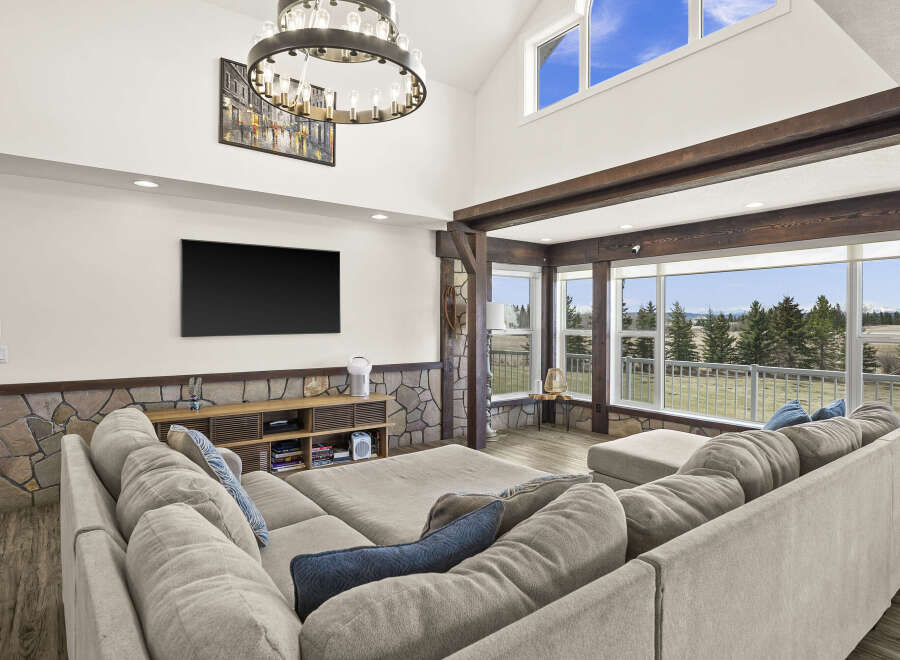 Step into luxury with this stunning living room, boasting a spacious sectional sofa and a cozy atmosphere.